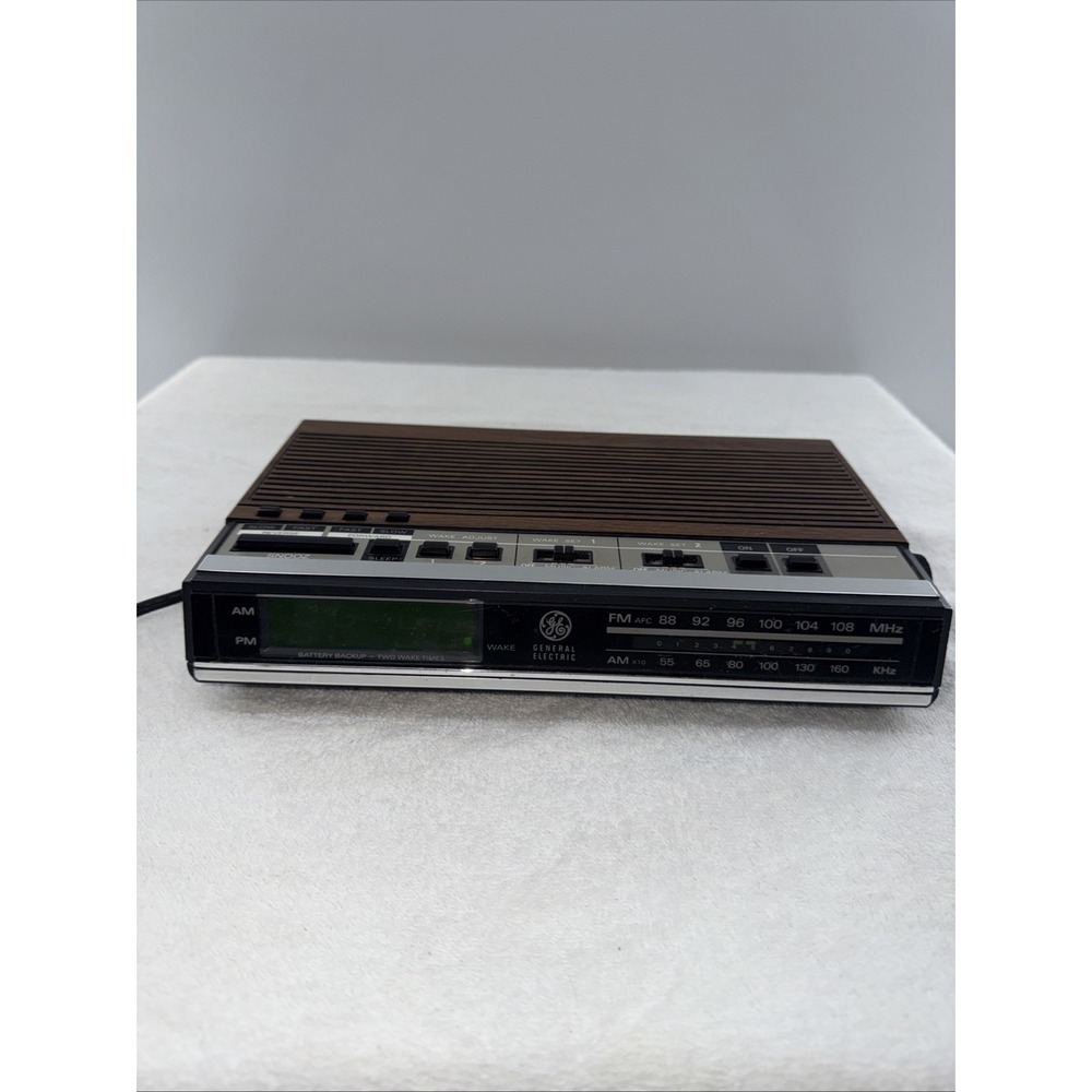 General Electric 7-4638A Alarm Clock Radio/Tested/2 Alarms 10" X 2" Wood grain